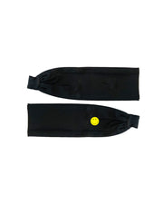 A black fabric fitness headband with a small yellow smiley face button on the front. 