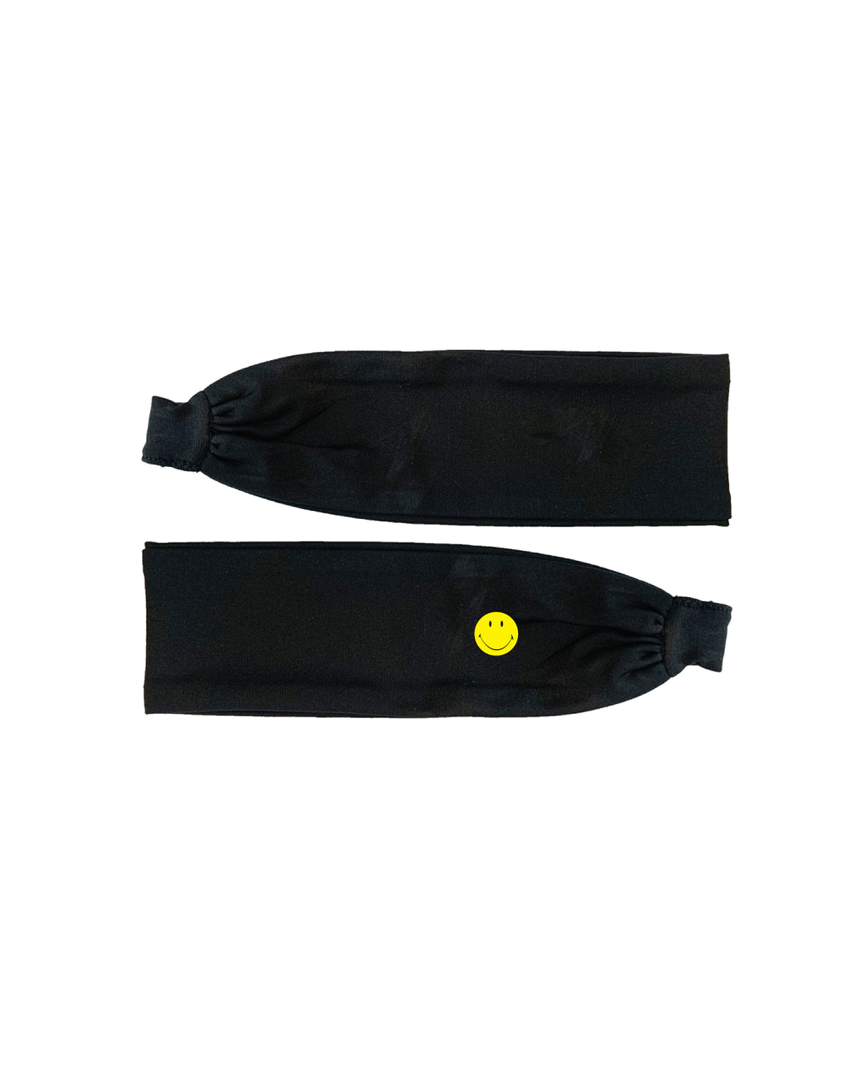 A black fabric fitness headband with a small yellow smiley face button on the front. 