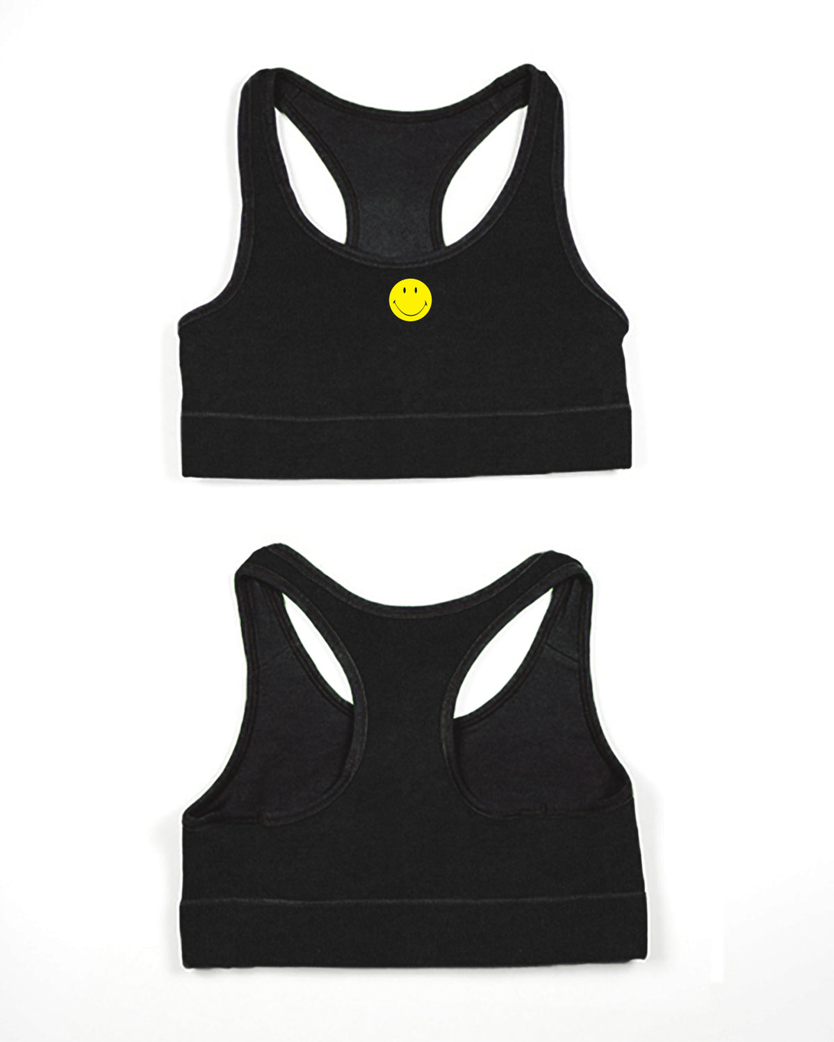 A black racerback sports bra displaying the front with a small yellow smiley face button at the center.