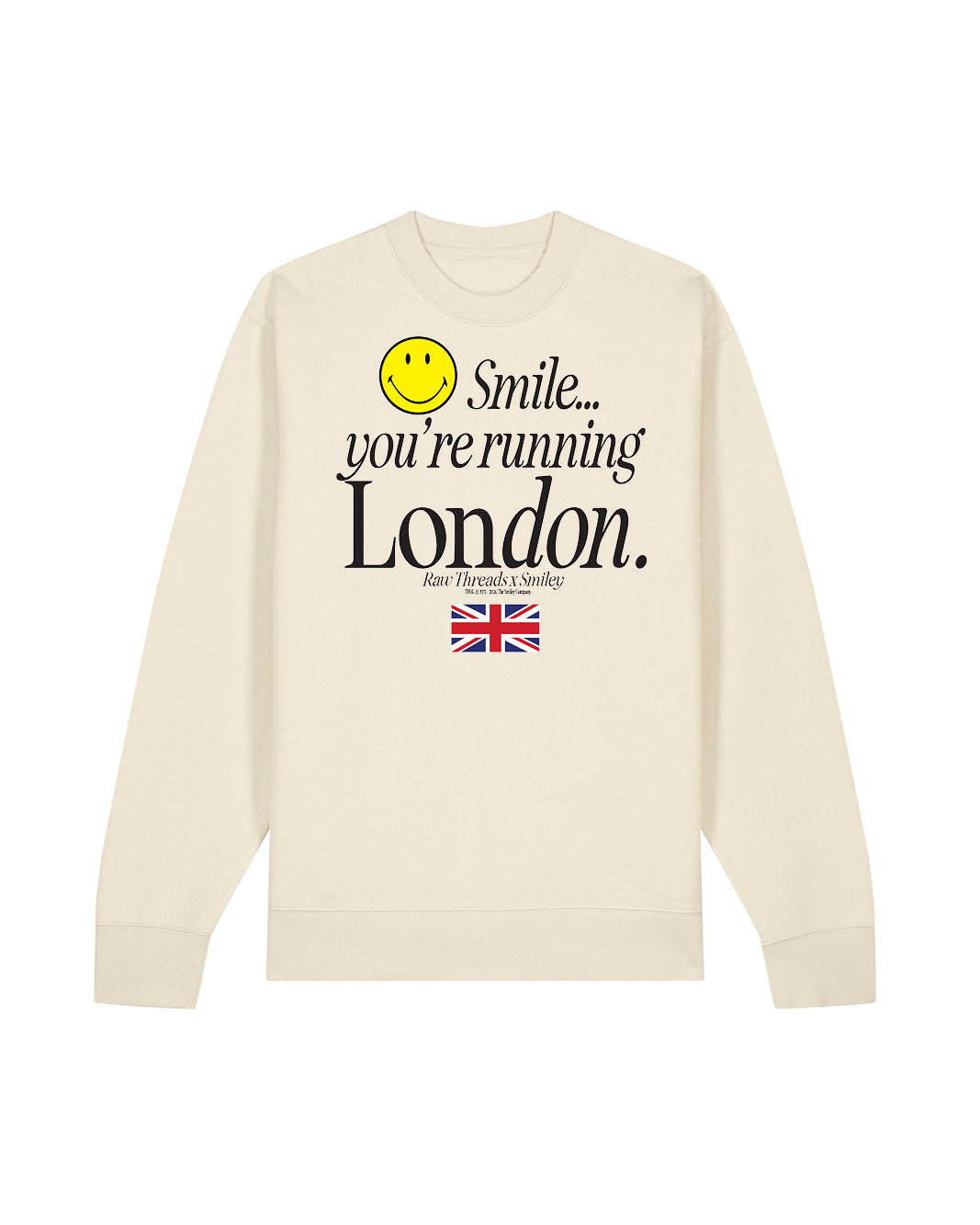 A natural tan gender-neutral crewneck sweatshirt featuring a graphic print on the front with a yellow smiley face and the text 'Smile you're running London' including the London flag and the Raw Threads x Smiley logo.